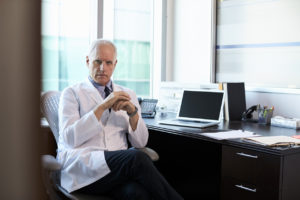 Doctor in Office with Computer HIPPA